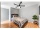 Cozy bedroom with modern ceiling fan and hardwood floors at 608 E Club Cir, Longwood, FL 32779