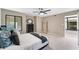Neutral bedroom with plush carpeting, a ceiling fan, and stylish decor, offering a serene and inviting atmosphere at 608 E Club Cir, Longwood, FL 32779