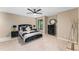 Well-lit bedroom showcases a queen-sized bed with stylish black accents and a coordinated bedside table arrangement at 608 E Club Cir, Longwood, FL 32779