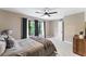 Comfortable bedroom featuring soft gray tones, a ceiling fan, and serene natural light creating a relaxing retreat at 608 E Club Cir, Longwood, FL 32779
