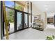 Grand foyer with large windows, modern doors, and elegant decor at 608 E Club Cir, Longwood, FL 32779