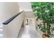 Bright foyer with neutral walls, white tile flooring, and a staircase to the second level at 608 E Club Cir, Longwood, FL 32779