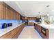 Modern kitchen features wood cabinets, white marble countertops, stainless steel appliances, and under cabinet lighting at 608 E Club Cir, Longwood, FL 32779