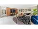 Large living room showcases an accent wall, stylish decor, and a comfortable seating area at 608 E Club Cir, Longwood, FL 32779