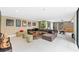 Spacious living area featuring contemporary decor, comfortable seating, and entertainment space at 608 E Club Cir, Longwood, FL 32779