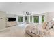 Spacious primary bedroom with large windows overlooking the outdoor greenery at 608 E Club Cir, Longwood, FL 32779