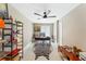 Stylish office space with black ceiling fan, zebra rug, and a modern shelving unit to inspire creativity and focus at 608 E Club Cir, Longwood, FL 32779