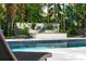 Relaxing pool area features a charming water fountain with tropical landscaping at 608 E Club Cir, Longwood, FL 32779