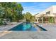 Inviting pool area with lounge chairs and well-manicured landscaping at 608 E Club Cir, Longwood, FL 32779