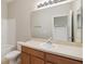 Neutral bathroom featuring a sink, toilet, bathtub and wide mirror at 6434 S Goldenrod Rd # 17B, Orlando, FL 32822