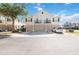 This is a shot of the home's exterior elevation, showing attached garages and small balconies at 6434 S Goldenrod Rd # 17B, Orlando, FL 32822