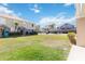 Townhomes featuring well-maintained lawns and varied architectural details at 6434 S Goldenrod Rd # 17B, Orlando, FL 32822