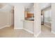 An open-concept kitchen area showcasing stainless steel appliances and adjacent bar seating space at 6434 S Goldenrod Rd # 17B, Orlando, FL 32822