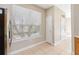 Bright kitchen nook showcasing large window with blinds, pantry, and neutral paint at 6434 S Goldenrod Rd # 17B, Orlando, FL 32822