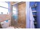 Updated bathroom featuring a glass-enclosed shower and tiled walls at 645 Upperriver Ct, Orlando, FL 32828