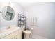Bathroom featuring a vanity with a round mirror at 645 Upperriver Ct, Orlando, FL 32828
