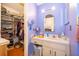 Bathroom with lavender walls and a walk in closet at 645 Upperriver Ct, Orlando, FL 32828