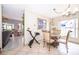 Dining area with tile flooring, bright light, and an open view to an adjacent room at 645 Upperriver Ct, Orlando, FL 32828