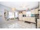 Spacious kitchen with tile flooring, natural light, appliances, and ample counter space at 645 Upperriver Ct, Orlando, FL 32828