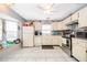 Spacious kitchen with tile flooring, natural light, stainless steel appliances, and ample storage at 645 Upperriver Ct, Orlando, FL 32828