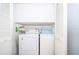 Laundry closet with new white washer and dryer at 645 Upperriver Ct, Orlando, FL 32828