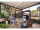 Screened patio area with a table and seating at 645 Upperriver Ct, Orlando, FL 32828