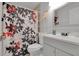 Neutral-toned bathroom with a shower over the tub and a modern white vanity at 6464 Inca St, Orlando, FL 32807