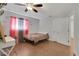 Spacious bedroom features wood-look floors, a ceiling fan, and closet at 6464 Inca St, Orlando, FL 32807