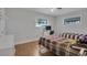 Bedroom with wood-look floors, ceiling fan and closet at 6464 Inca St, Orlando, FL 32807