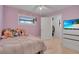 Bright bedroom featuring tile floors, a ceiling fan, and a closet at 6464 Inca St, Orlando, FL 32807