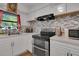 Updated kitchen featuring stainless steel appliances and modern countertops at 6464 Inca St, Orlando, FL 32807
