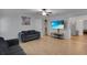 Comfortable living room with wood floors, modern ceiling fan, and updated decor at 6464 Inca St, Orlando, FL 32807