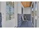 Cozy screened front porch with chairs and a decorative glass front door at 6464 Inca St, Orlando, FL 32807