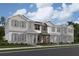 Charming townhomes boast Hardie siding, stylish shutters, and covered front porches at 660 Pothos St, Apopka, FL 32703