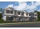 Charming townhomes boast Hardie siding, stylish shutters, and covered front porches at 660 Pothos St, Apopka, FL 32703