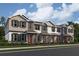 Charming townhomes boast Hardie siding, stylish shutters, and covered front porches at 660 Pothos St, Apopka, FL 32703