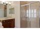 Bathroom with glass door shower, vanity, and tiled walls at 6857 Dolce St, Orlando, FL 32819