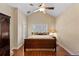 Comfortable bedroom with vaulted ceilings, wooden floors, and a cozy atmosphere at 6857 Dolce St, Orlando, FL 32819