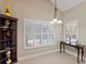 Bright breakfast nook with plantation shutters overlooking the pool and landscaped yard at 6857 Dolce St, Orlando, FL 32819