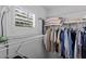 Organized walk-in closet with shelving and hanging space at 6857 Dolce St, Orlando, FL 32819