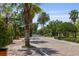 Community entrance featuring brick paved street, lush landscaping and gated entry at 6857 Dolce St, Orlando, FL 32819