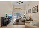 Spacious living room with high ceilings, tile floors, and sliding doors to lanai at 6857 Dolce St, Orlando, FL 32819