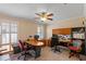 Spacious home office featuring natural light, desk space for two, and built-in shelving at 6857 Dolce St, Orlando, FL 32819