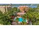 Aerial view of the community pool and recreation area with palm trees and lounge chairs at 6857 Dolce St, Orlando, FL 32819