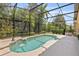 Sparkling pool surrounded by screened lanai and lush landscaping for privacy at 6857 Dolce St, Orlando, FL 32819