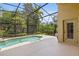 Screened pool, patio, and manicured green outdoor spaces make for luxurious outdoor living at 6857 Dolce St, Orlando, FL 32819