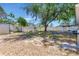 Large backyard featuring mature shade trees and firepit with privacy fences at 7507 Duo Lakes Dr, Orlando, FL 32810