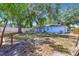 Large backyard view of the home displaying privacy fencing and fire pit area at 7507 Duo Lakes Dr, Orlando, FL 32810