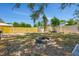 Spacious backyard with a fire pit and plenty of room for outdoor activities at 7507 Duo Lakes Dr, Orlando, FL 32810