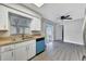 Well-lit kitchen with modern flooring and appliances for easy meal preparation and enjoyment at 7507 Duo Lakes Dr, Orlando, FL 32810